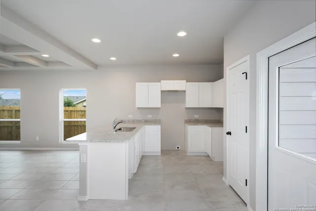 a bathroom with a sink tub and shower