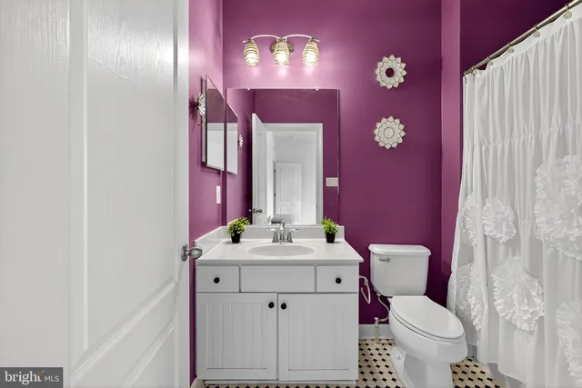 a bathroom with a tub and shower