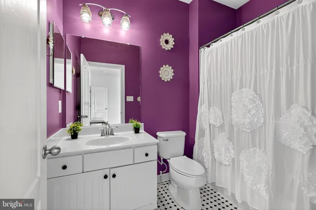 a kitchen with a table and chairs in it