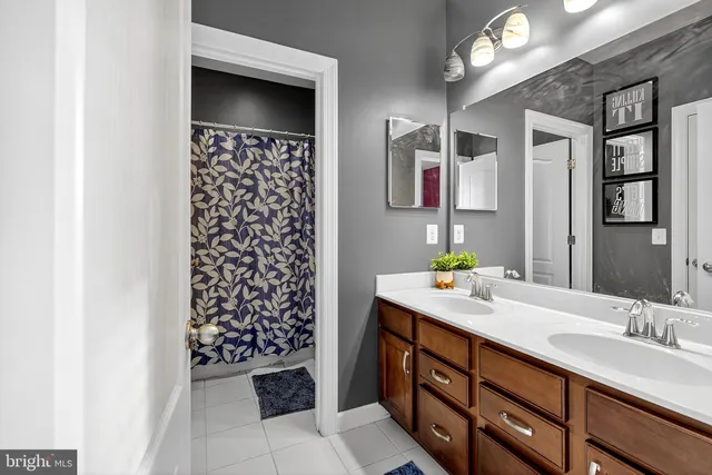 a bedroom with a large bed and a flat tv screen