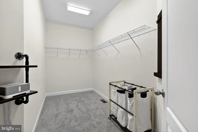 a picture of a bathroom with a sink and a white cabinet