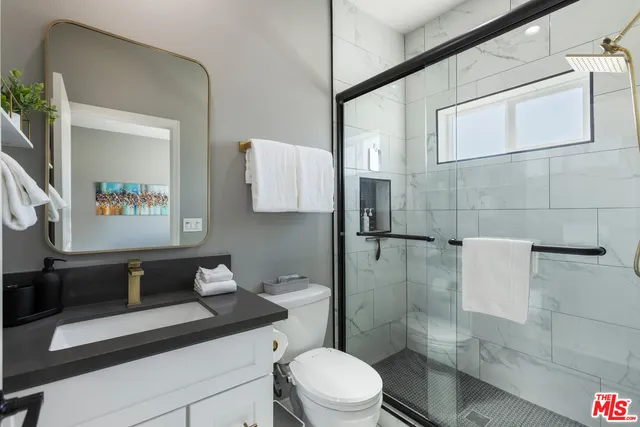 a bedroom with a bed and a lamp