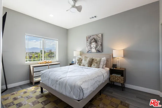 a bedroom with a bed and window