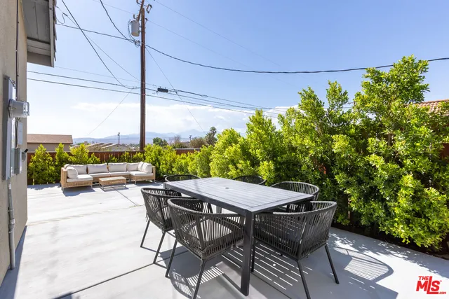 a outdoor living space with furniture and garden view