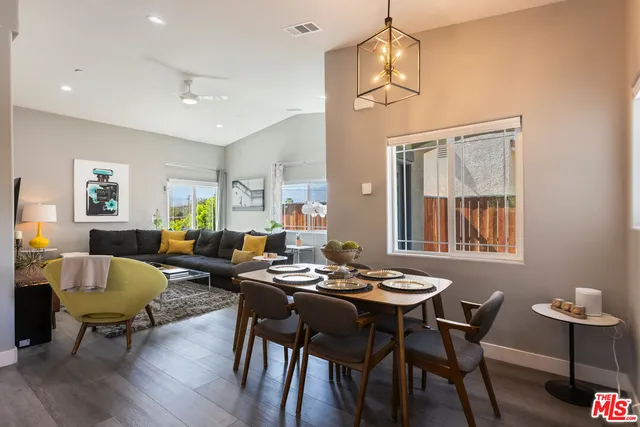 a view of a dining room with furniture window and wooden floor