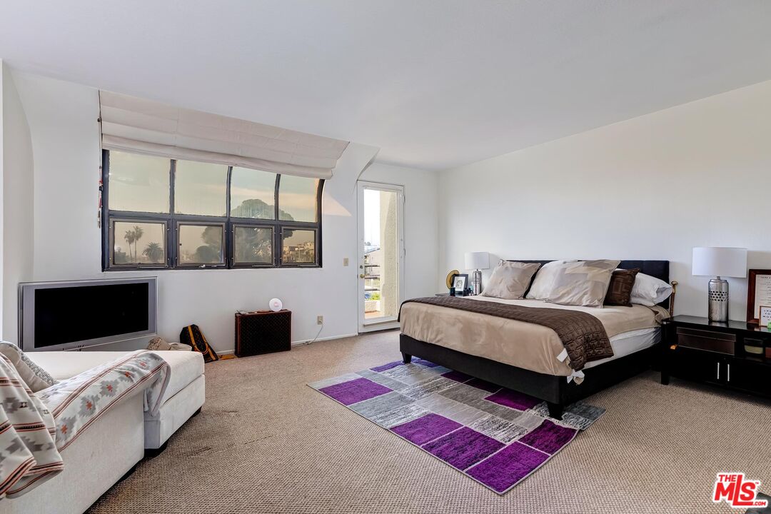 132 Convoy Street Playa del Rey, CA 90293 - Photo 7 of 16 a spacious bedroom with a bed and wooden floor