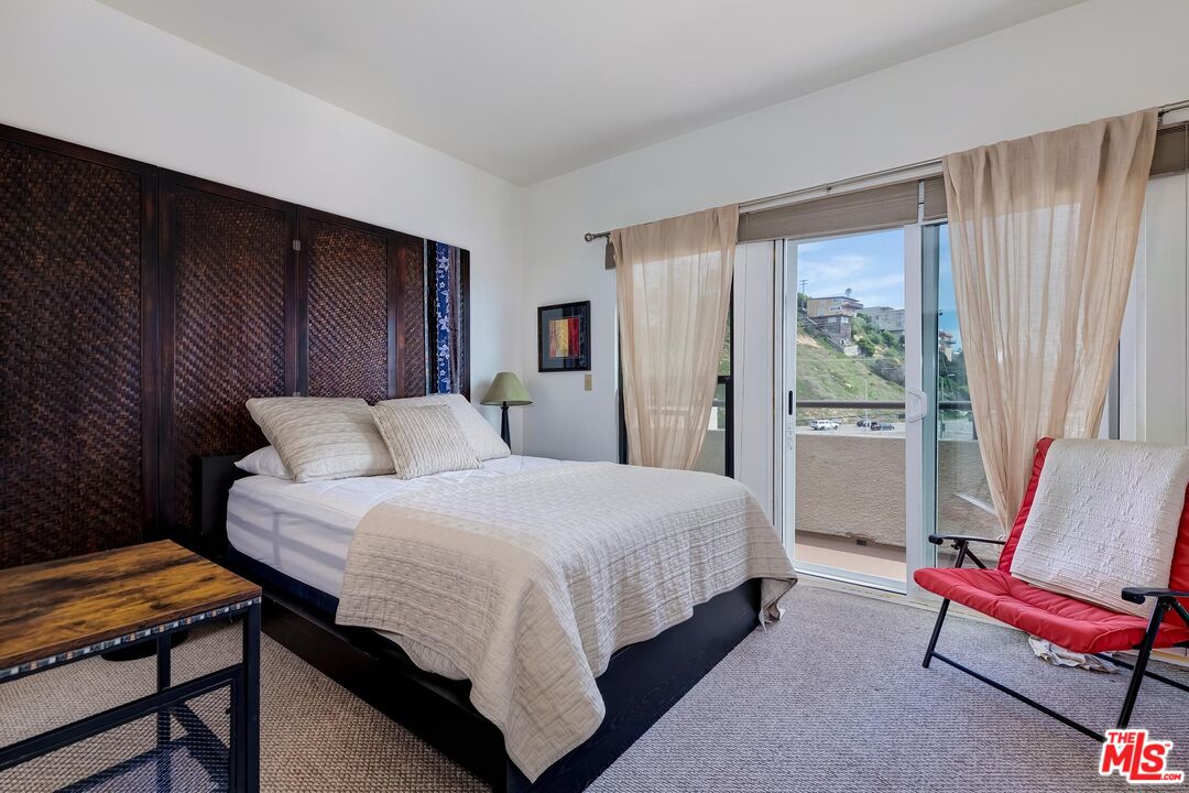 132 Convoy Street Playa del Rey, CA 90293 - Photo 9 of 16 a bedroom with a bed and wooden floor