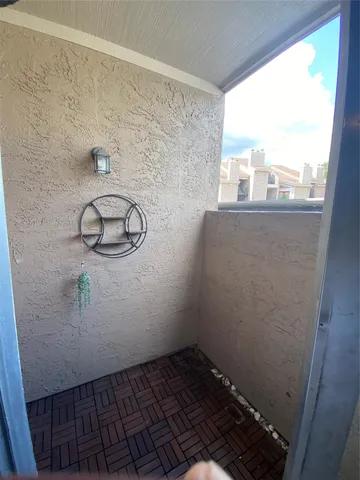 a view of a room with rack on the wall and window