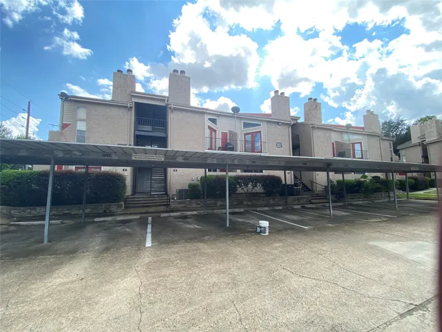 a view of a chairs and a table in the patio