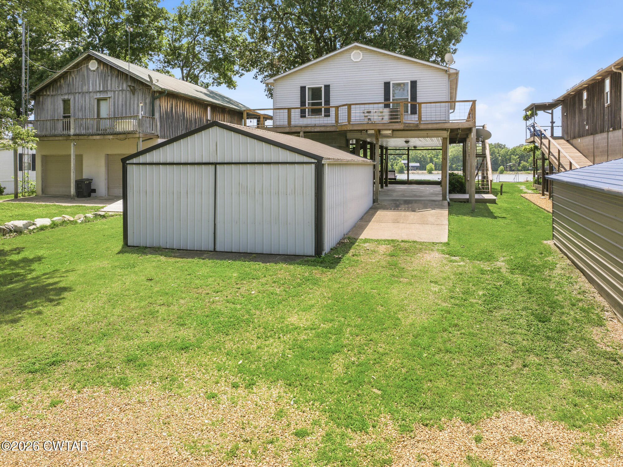 1728 Yarbro Landing Lane Decaturville, TN 38329 - Photo 23 of 44 a view of a house with a yard and sitting area