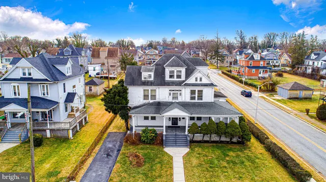 a aerial view of a house with swimming pool yard and outdoor seating