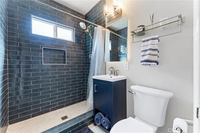 a kitchen with a sink and a refrigerator