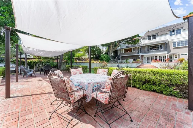 a picture of a bench in front of a gate