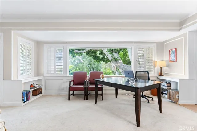 a view of a livingroom with furniture and a window