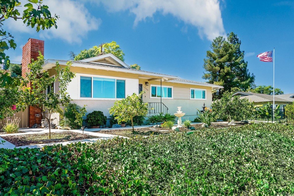10085 Del Rio Road Spring Valley, CA 91977 - Photo 1 of 1 a front view of a house with garden