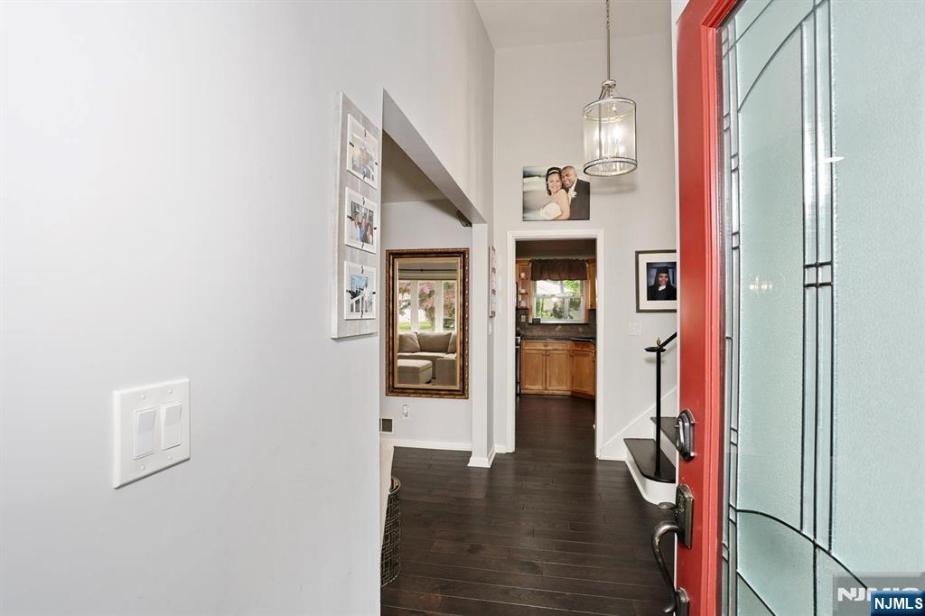 30 Brookfield Road Dumont, NJ 07628 - Photo 3 of 50 a view of a hallway with wooden floor and entryway