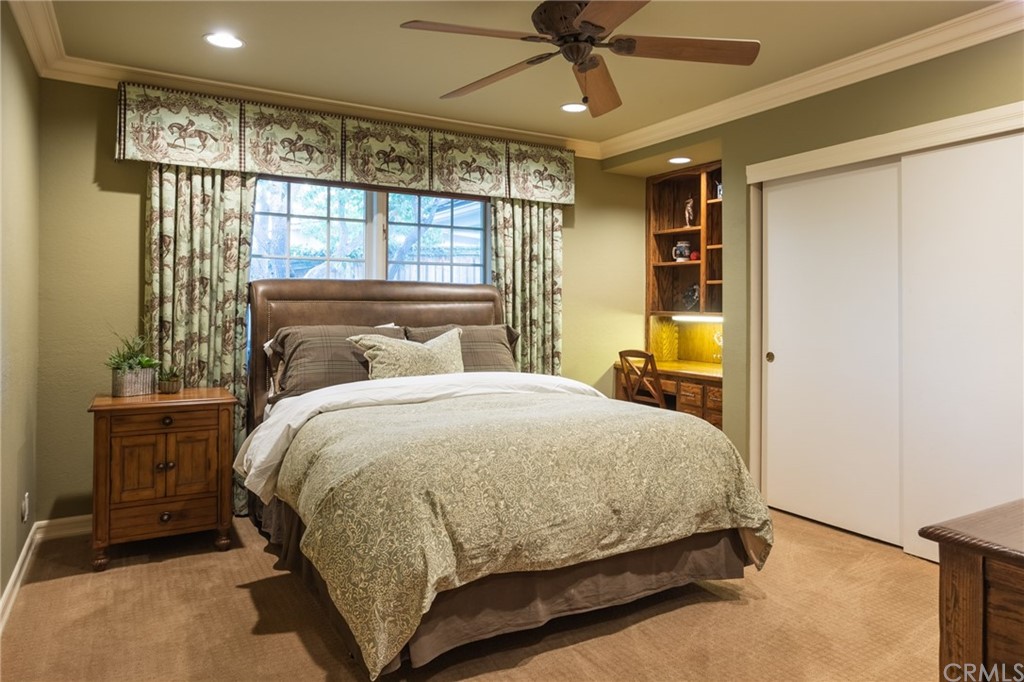 19051 Mesa Drive Villa Park, CA 92861 - Photo 12 of 28 a bedroom with a large bed and a chandelier