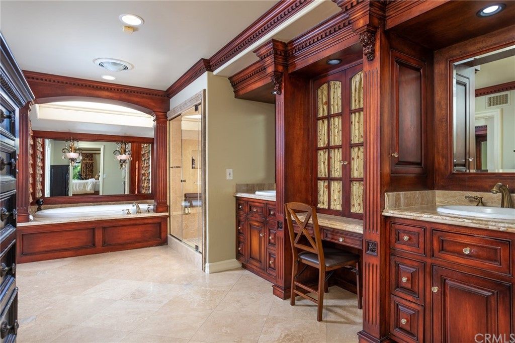 19051 Mesa Drive Villa Park, CA 92861 - Photo 25 of 28 a spacious bathroom with a granite countertop tub and a sink