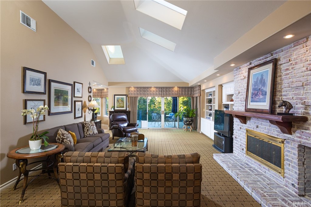 19051 Mesa Drive Villa Park, CA 92861 - Photo 7 of 28 a living room with furniture a large window and a fireplace