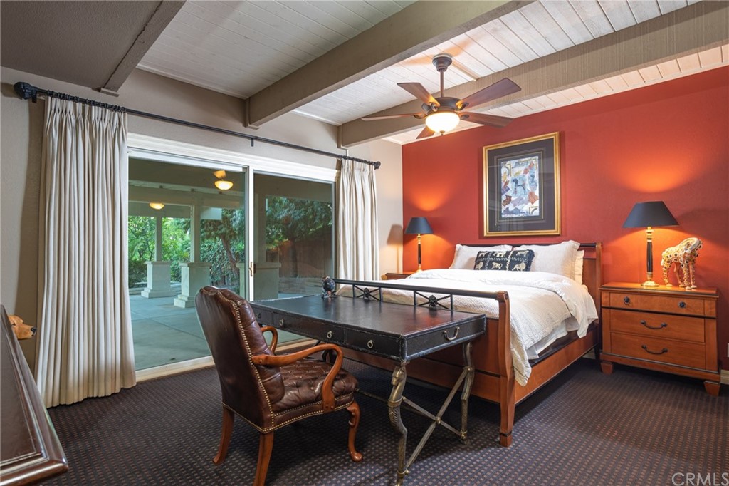 19051 Mesa Drive Villa Park, CA 92861 - Photo 10 of 28 a bedroom with a bed a chandelier and a window