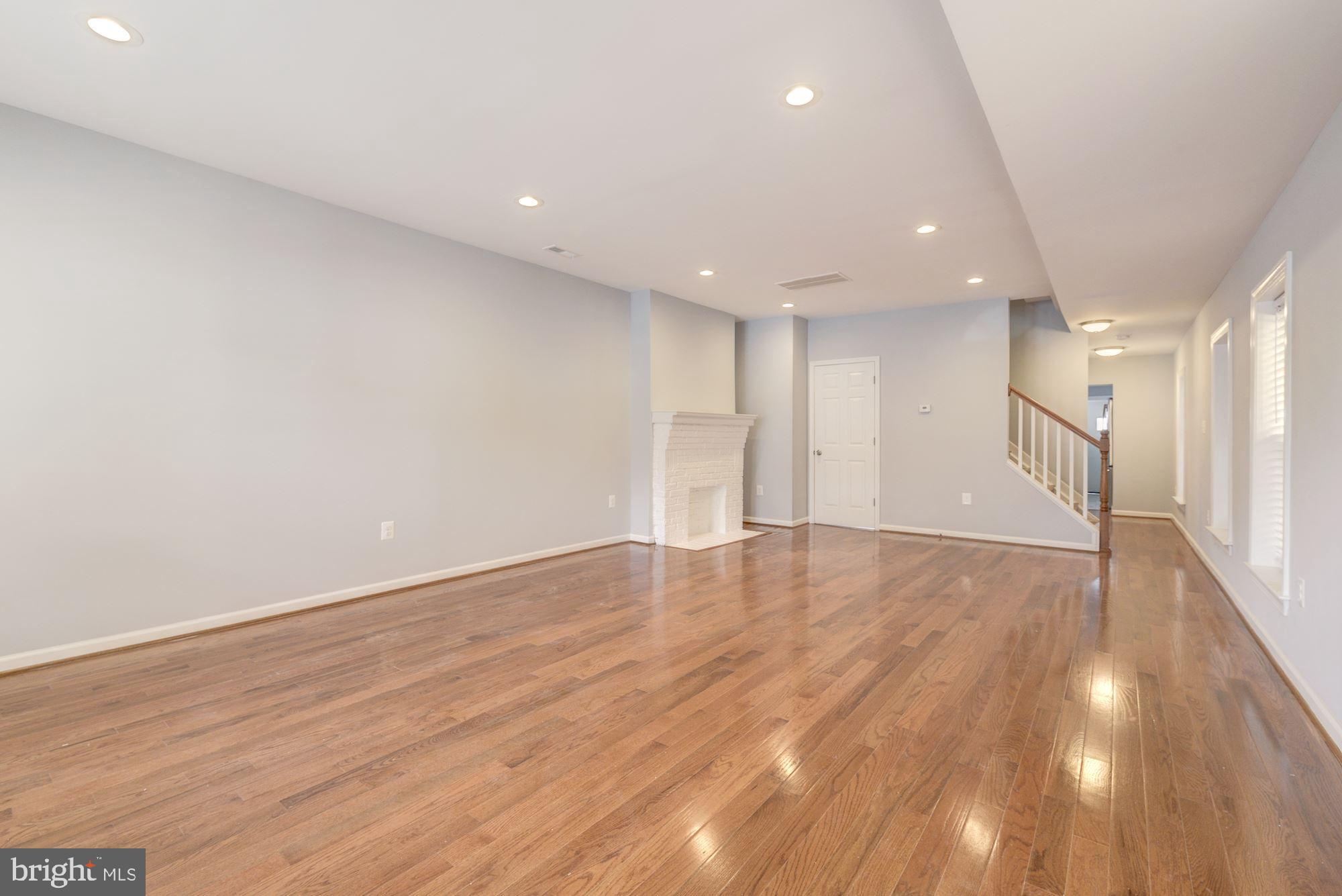 1914 10th Street Northwest Washington, DC 20001 - Photo 2 of 27 a view of an empty room with wooden floor