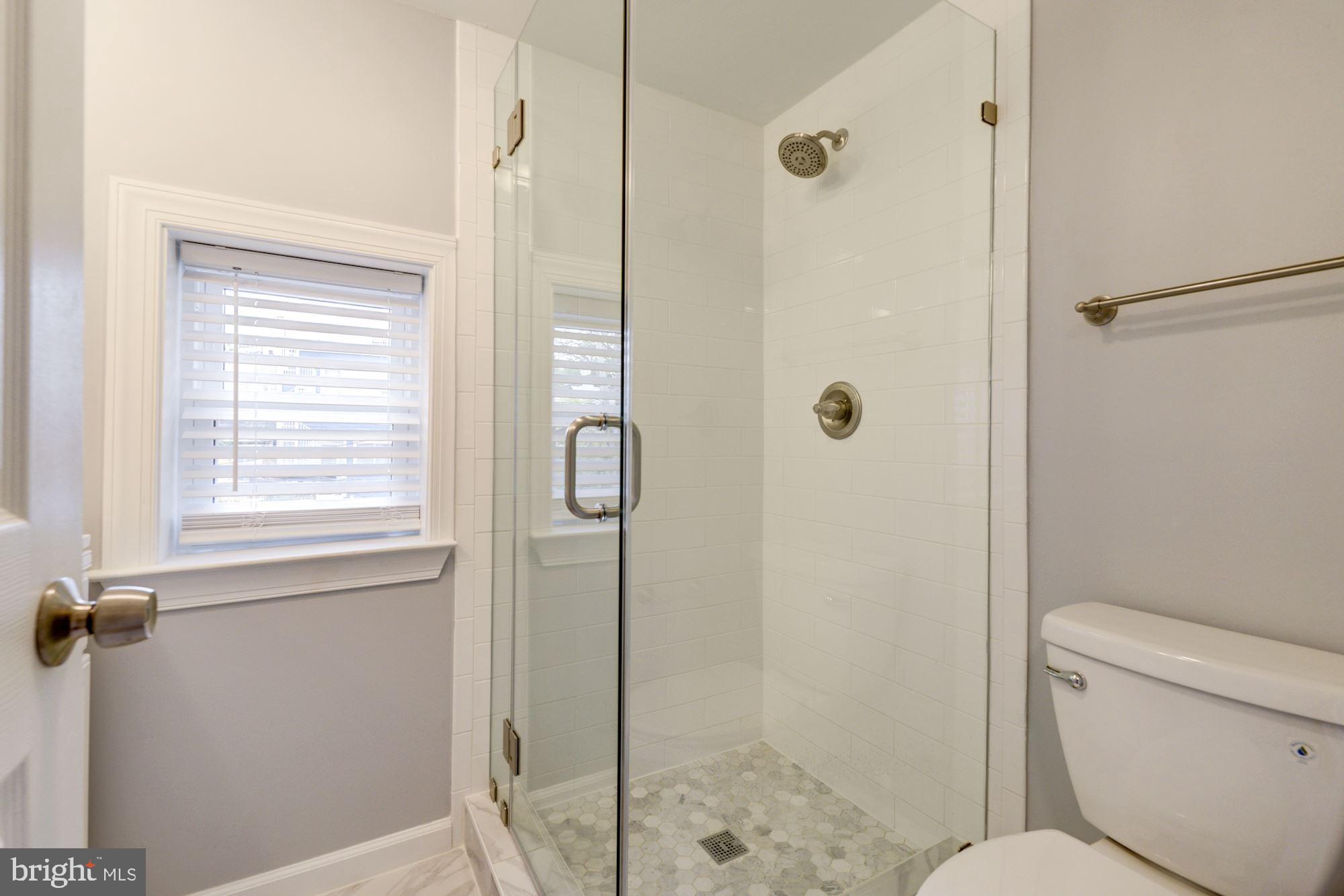 1914 10th Street Northwest Washington, DC 20001 - Photo 25 of 27 a bathroom with a shower and toilet