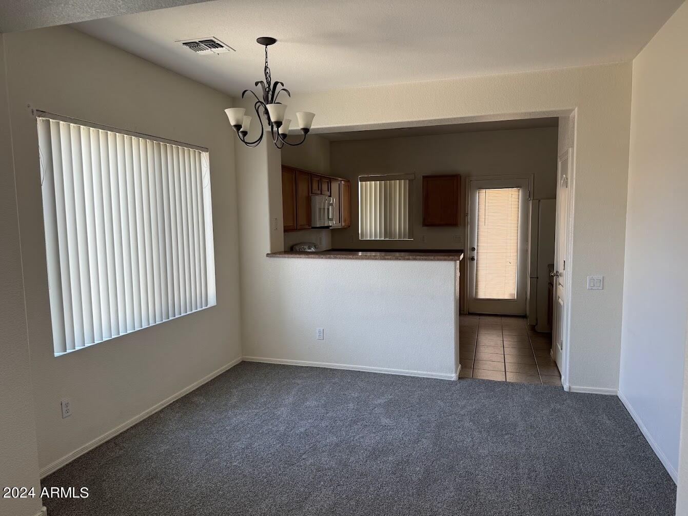 9401 West Berkeley Road Phoenix, AZ 85037 - Photo 11 of 27 a view of a room with a windows and fireplace