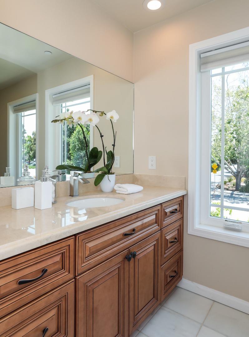 161 Willow Road Menlo Park, CA 94025 - Photo 13 of 14 a sink with a window and cabinets