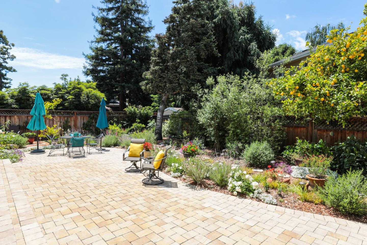 161 Willow Road Menlo Park, CA 94025 - Photo 14 of 14 a view of a backyard with a sitting area and furniture
