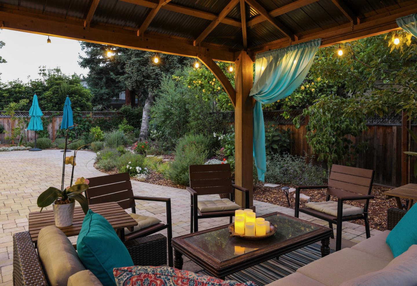 161 Willow Road Menlo Park, CA 94025 - Photo 3 of 14 a view of a chairs and table in patio with a fire pit