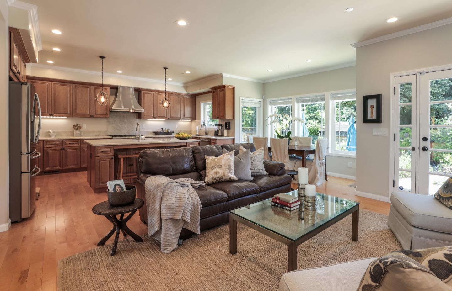 161 Willow Road Menlo Park, CA 94025 - Photo 6 of 14 a living room kitchen with furniture and a wooden floor