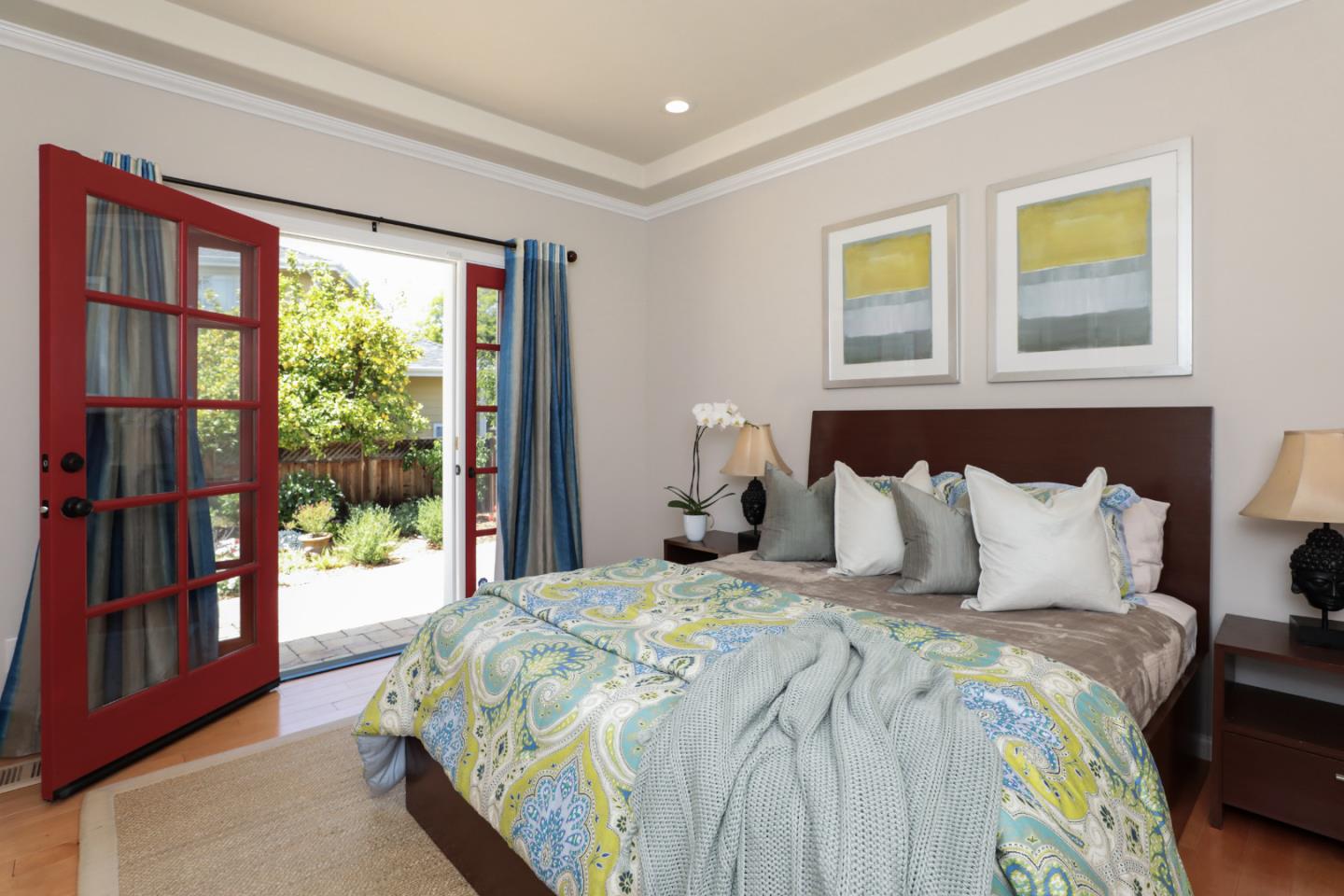 161 Willow Road Menlo Park, CA 94025 - Photo 9 of 14 a bedroom with a large bed and a window