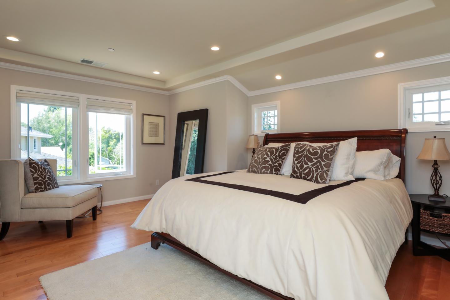 161 Willow Road Menlo Park, CA 94025 - Photo 10 of 14 a bedroom with a large bed and a couch