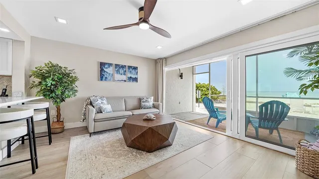 a kitchen with kitchen island a sink and a refrigerator