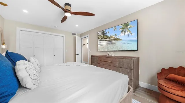 an aerial view of a multi story residential apartment building with yard and parking space