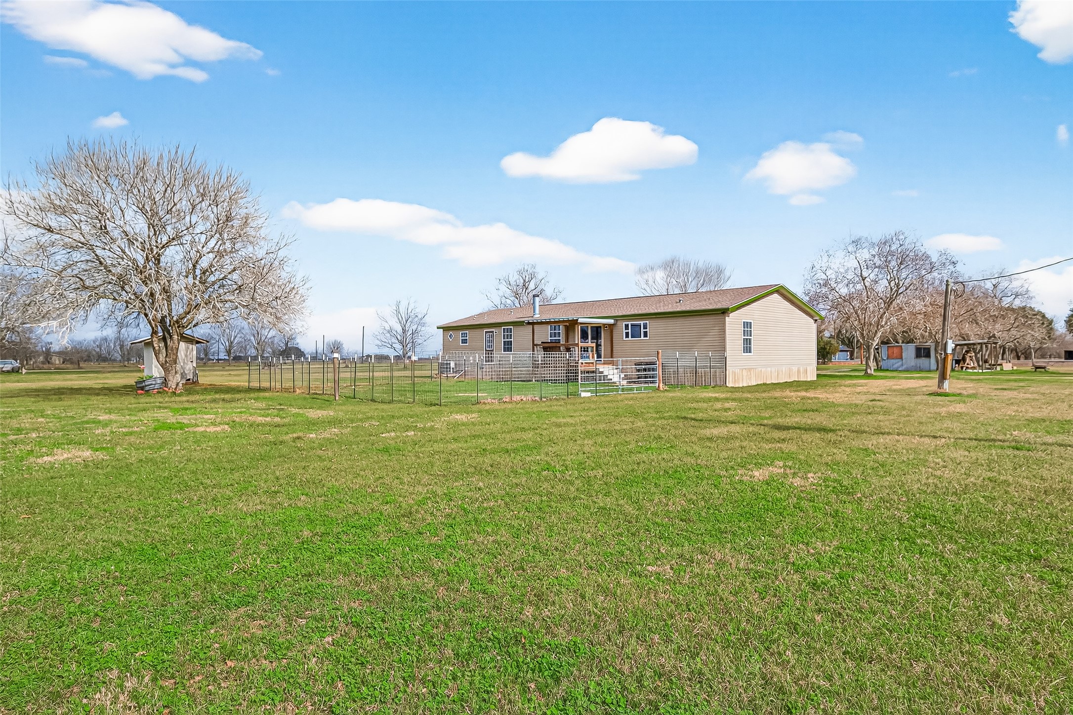 9820 Oberrender Road Needville, TX 77461 - Photo 29 of 34 Rear Elevation/Fenced In Yard