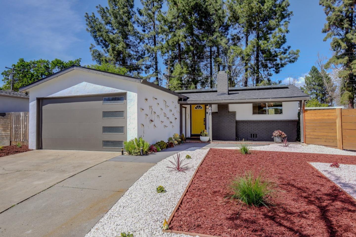 681 Arnold Drive Gilroy, CA 95020 - Photo 11 of 55 a front view of a house with garden