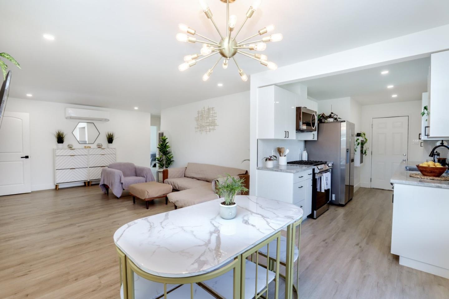 681 Arnold Drive Gilroy, CA 95020 - Photo 17 of 55 a living room with furniture kitchen view and a wooden floor