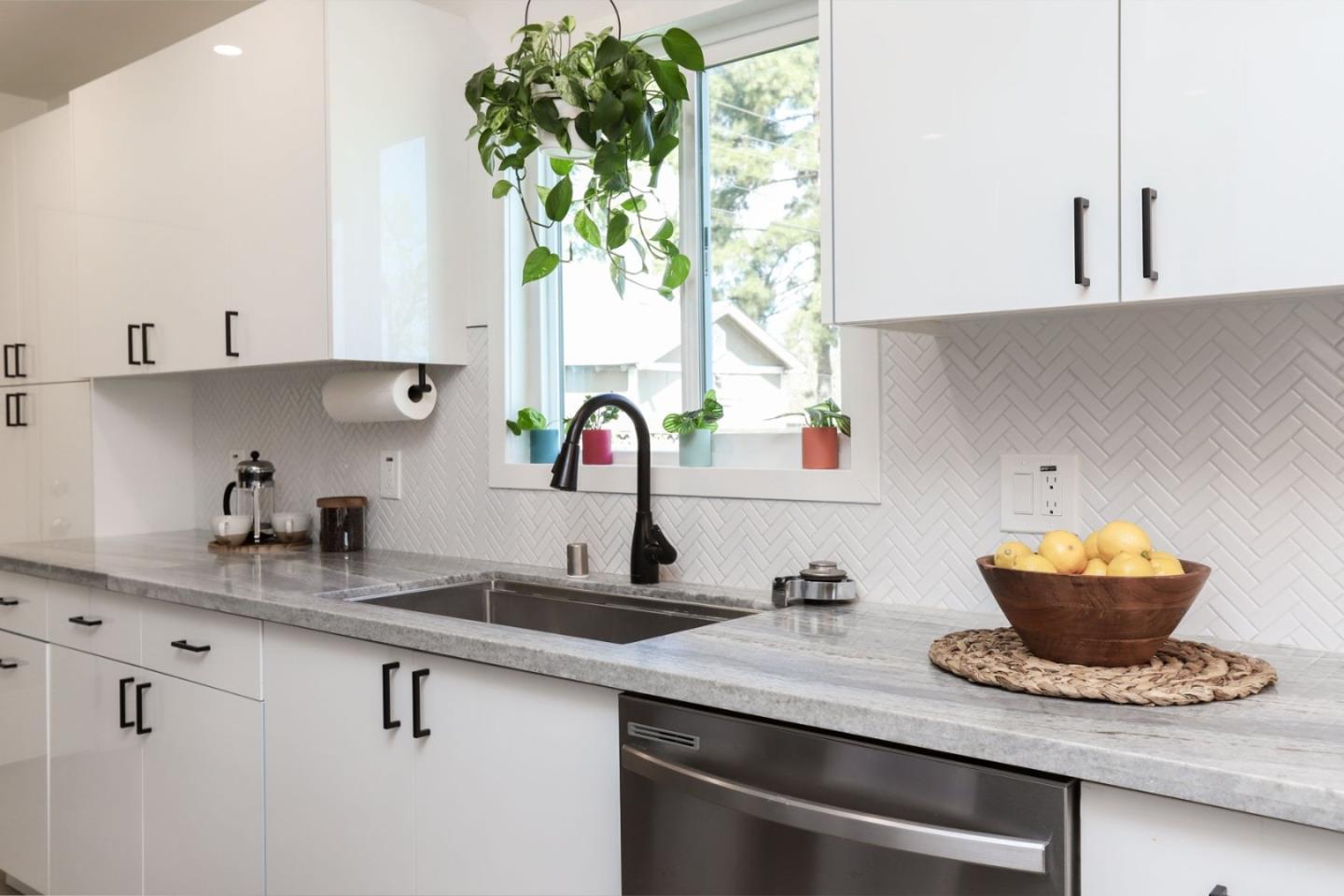 681 Arnold Drive Gilroy, CA 95020 - Photo 20 of 55 a kitchen with a sink and a potted plant