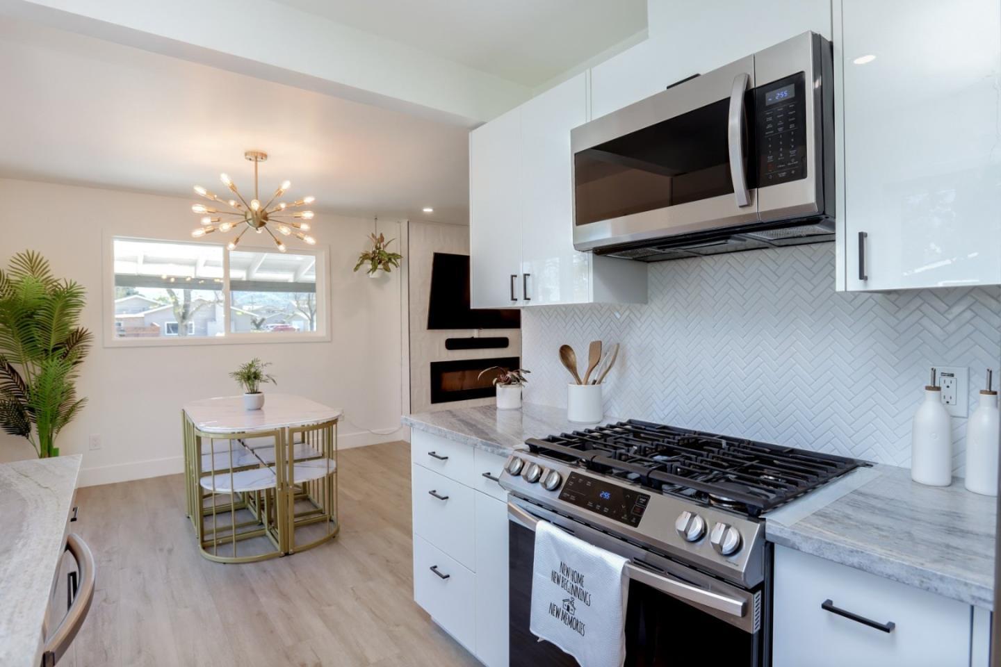 681 Arnold Drive Gilroy, CA 95020 - Photo 24 of 55 a kitchen with a stove and a microwave