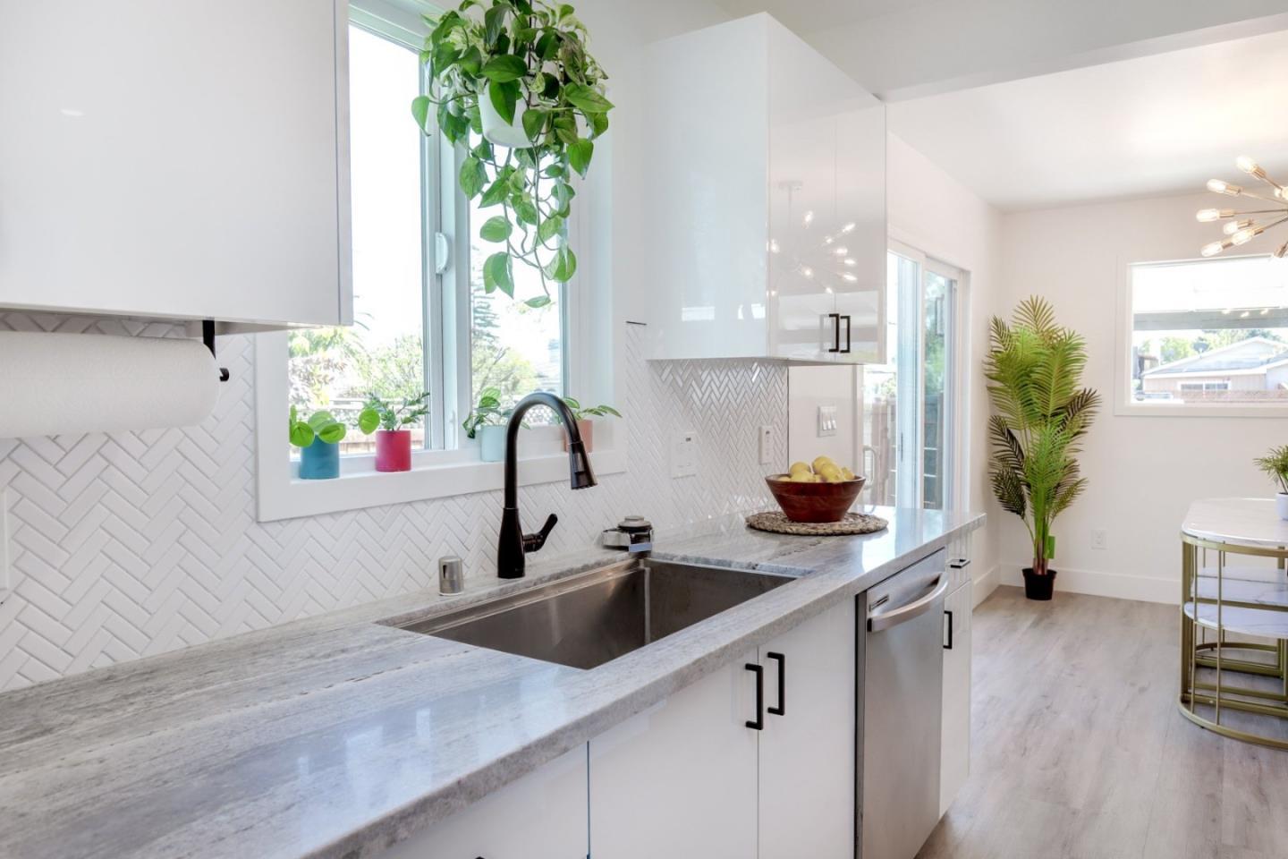 681 Arnold Drive Gilroy, CA 95020 - Photo 25 of 55 a kitchen with a sink and a potted plant