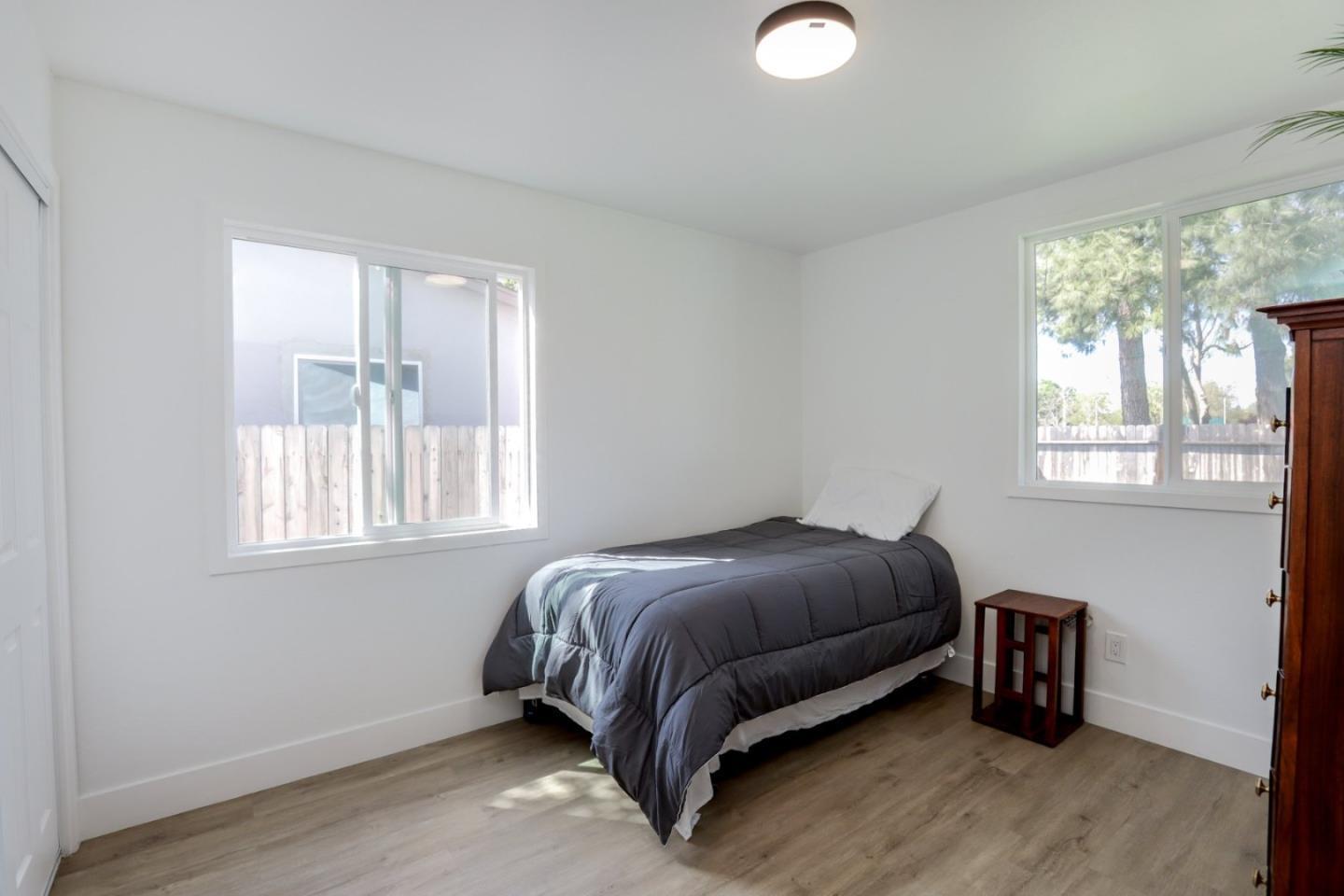 681 Arnold Drive Gilroy, CA 95020 - Photo 29 of 55 a bed sitting in a bedroom next to a window