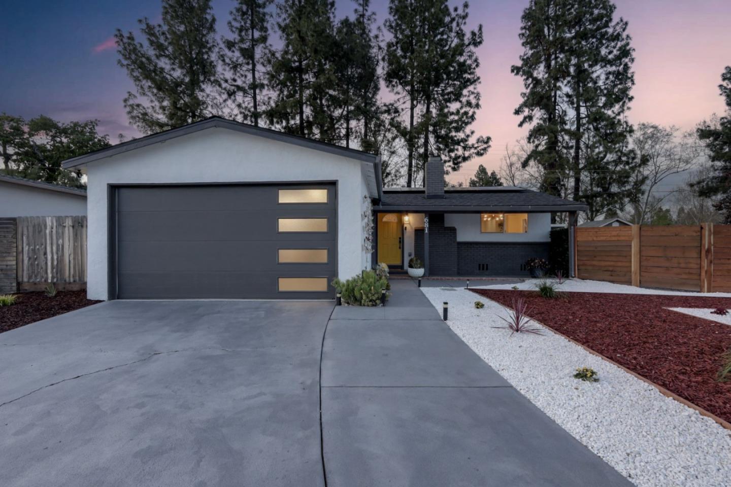 681 Arnold Drive Gilroy, CA 95020 - Photo 3 of 55 a front view of a house with a yard and garage