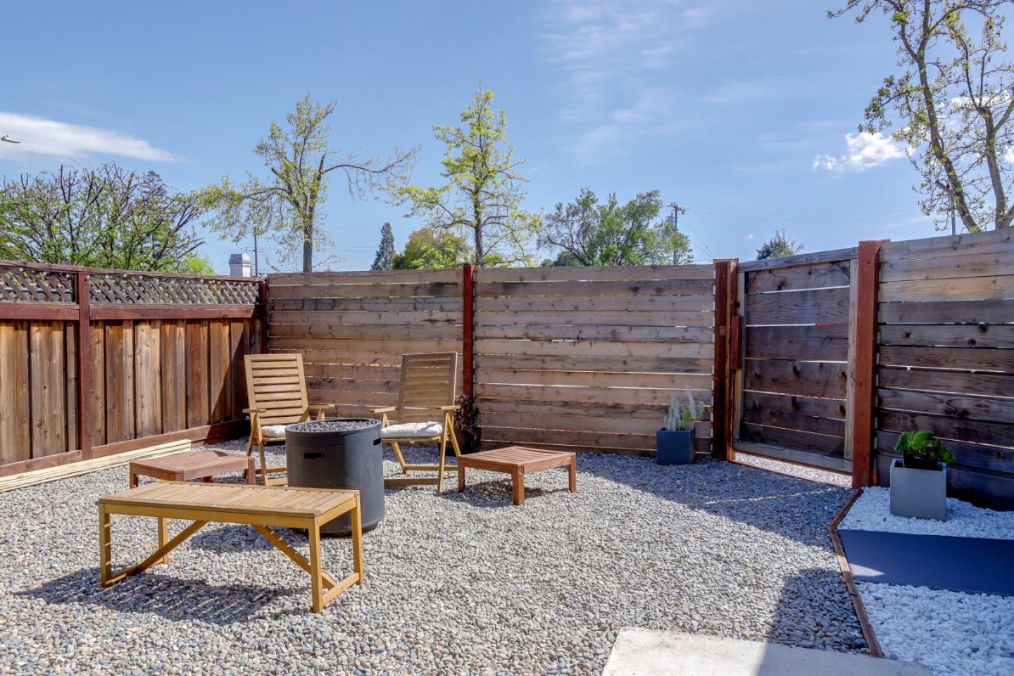 681 Arnold Drive Gilroy, CA 95020 - Photo 37 of 55 a backyard of a house with barbeque oven table and chairs