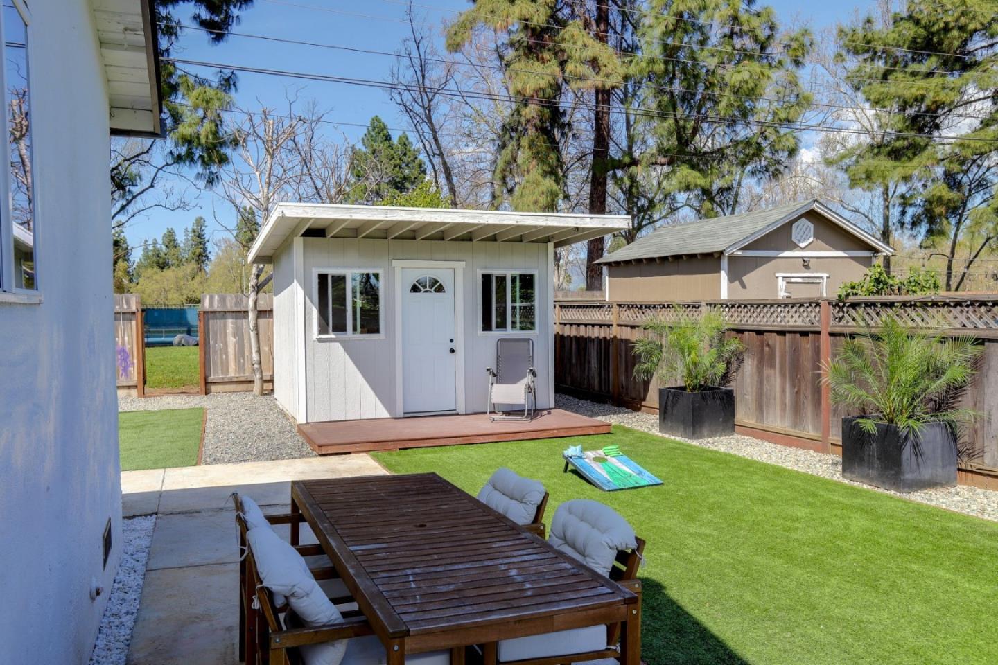 681 Arnold Drive Gilroy, CA 95020 - Photo 39 of 55 a view of a chairs and table in backyard of the house