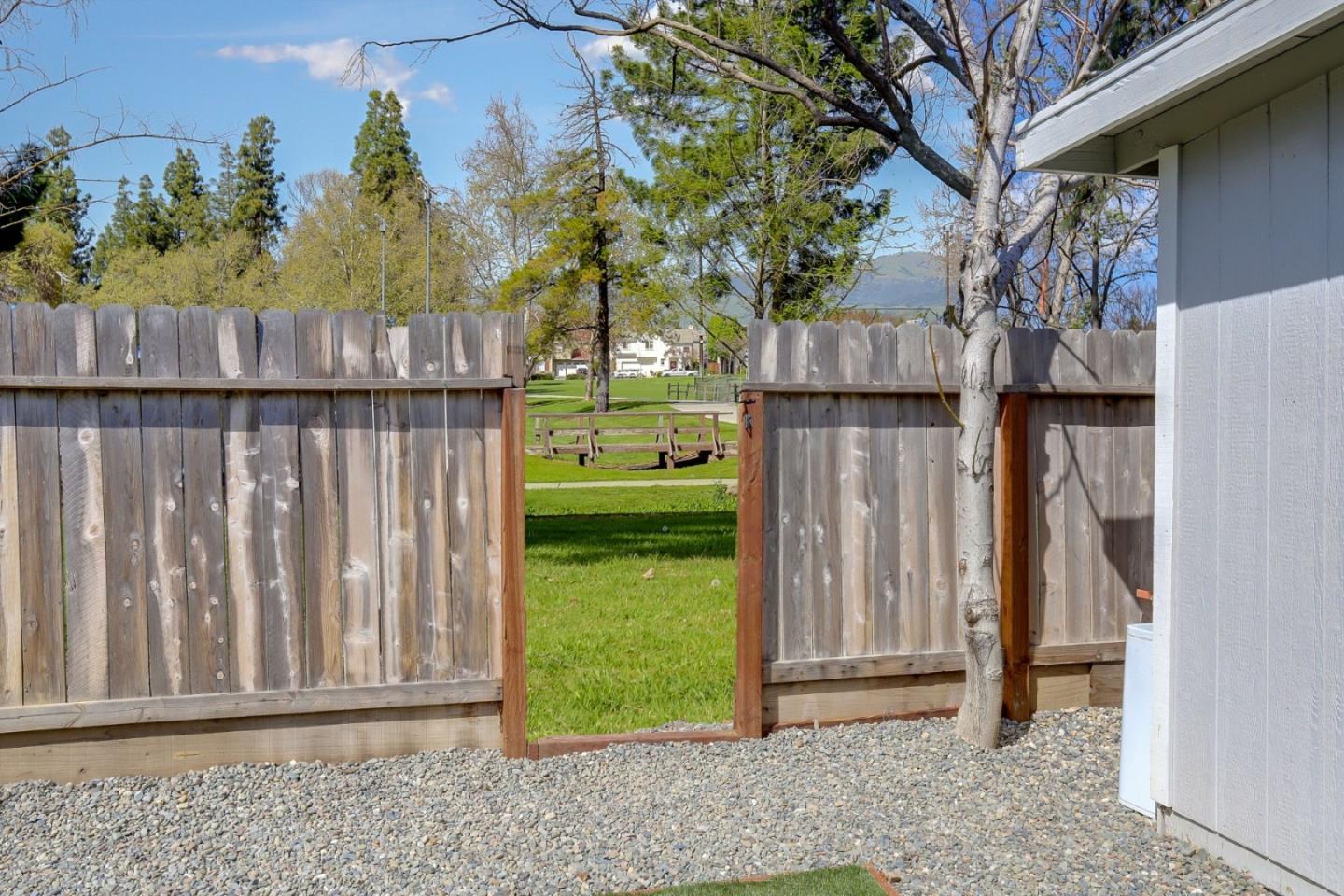 681 Arnold Drive Gilroy, CA 95020 - Photo 47 of 55 a view of a backyard with wooden fence