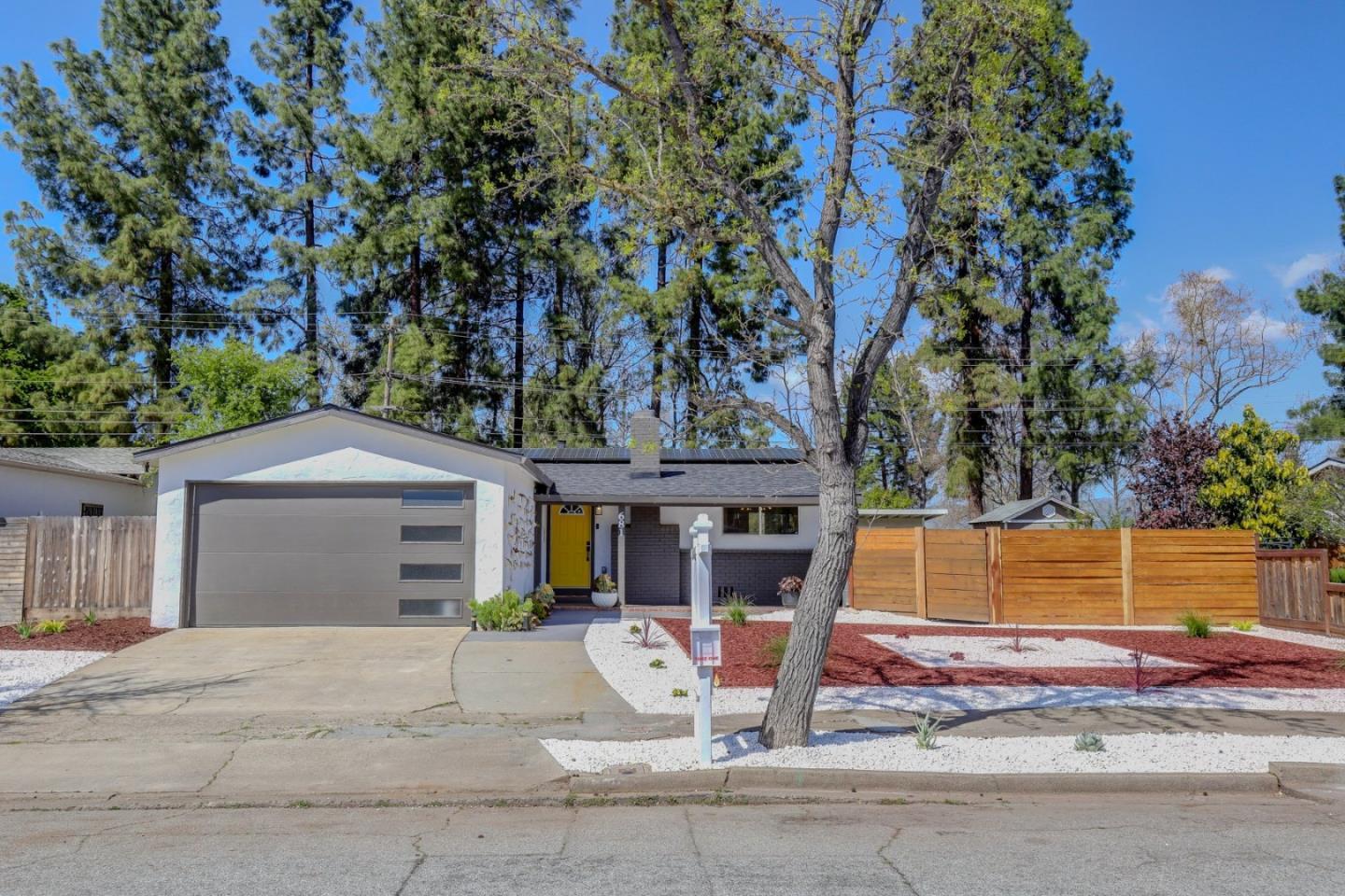 681 Arnold Drive Gilroy, CA 95020 - Photo 8 of 55 a front view of a house with garden