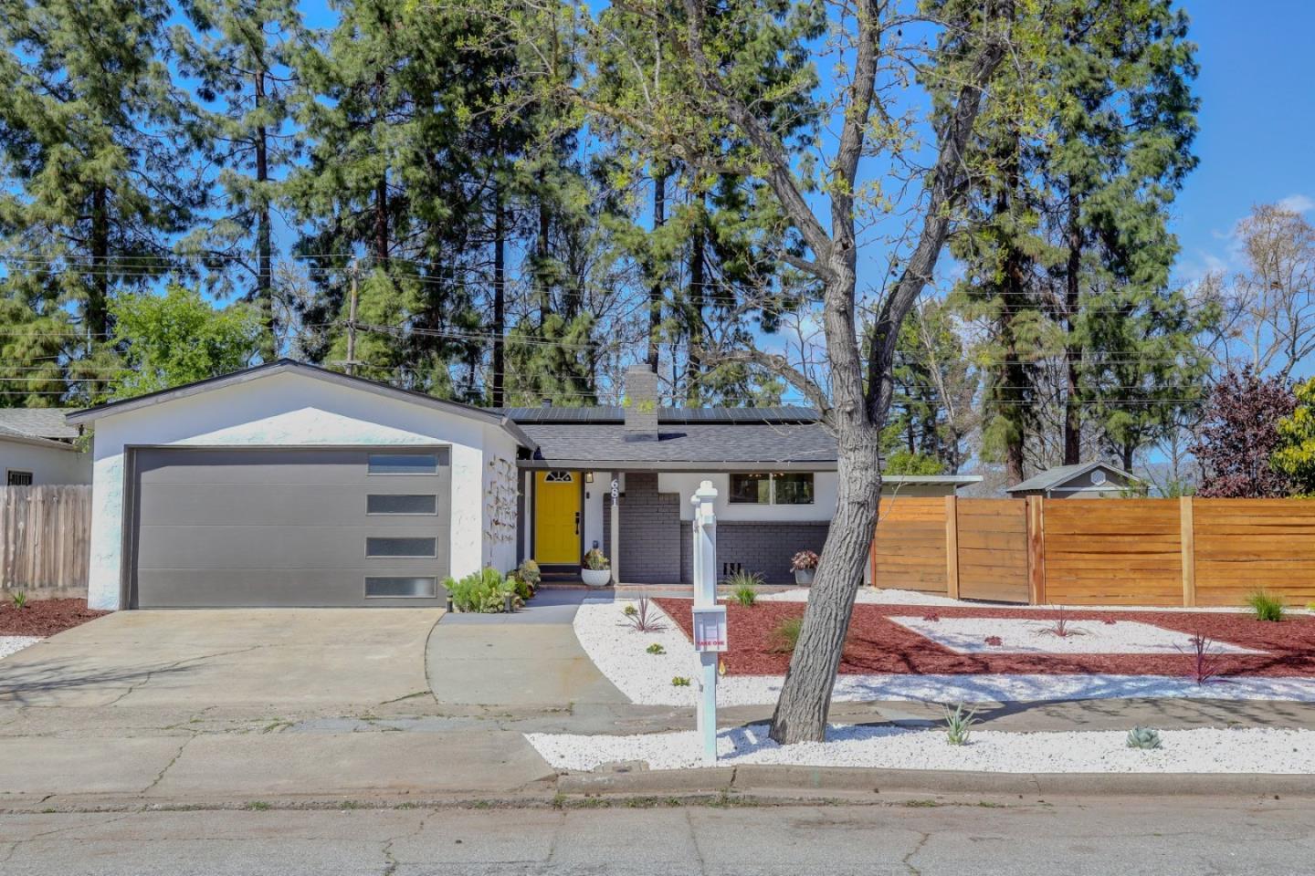 681 Arnold Drive Gilroy, CA 95020 - Photo 9 of 55 a front view of a house with garden