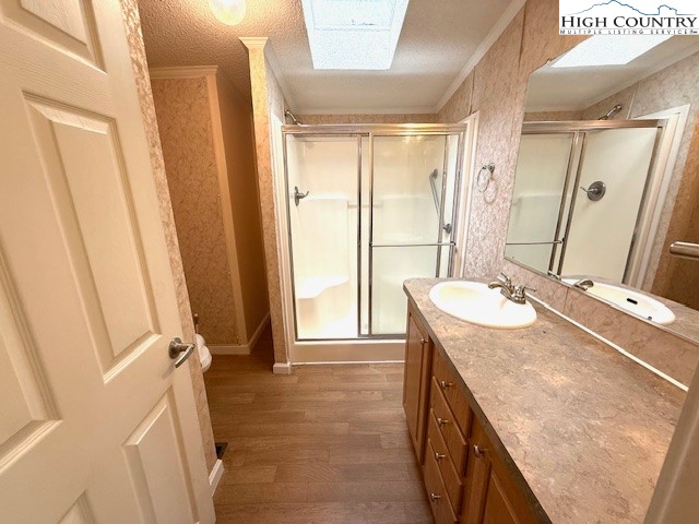 1269 Howell Road Lansing, NC 28643 - Photo 12 of 34 a bathroom with a granite countertop sink and a mirror