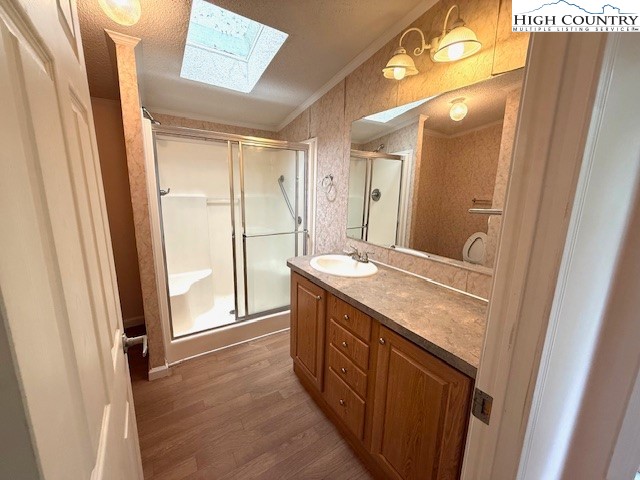 1269 Howell Road Lansing, NC 28643 - Photo 13 of 34 a bathroom with a granite countertop sink a mirror and a shower